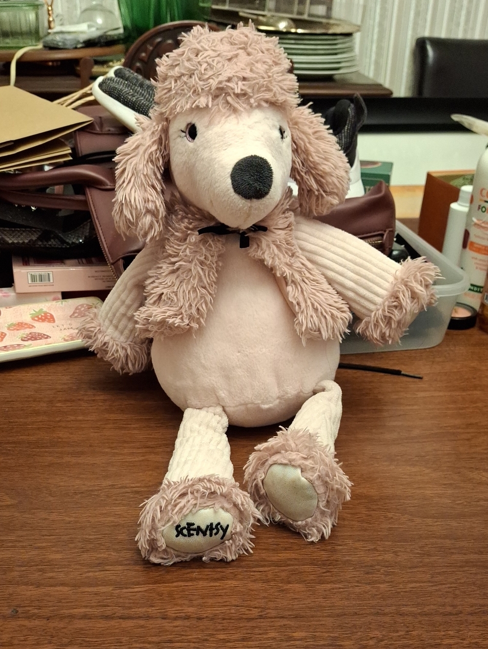 Posh the Poodle, a retired pink poodle plush from the Scentsy Buddy collection